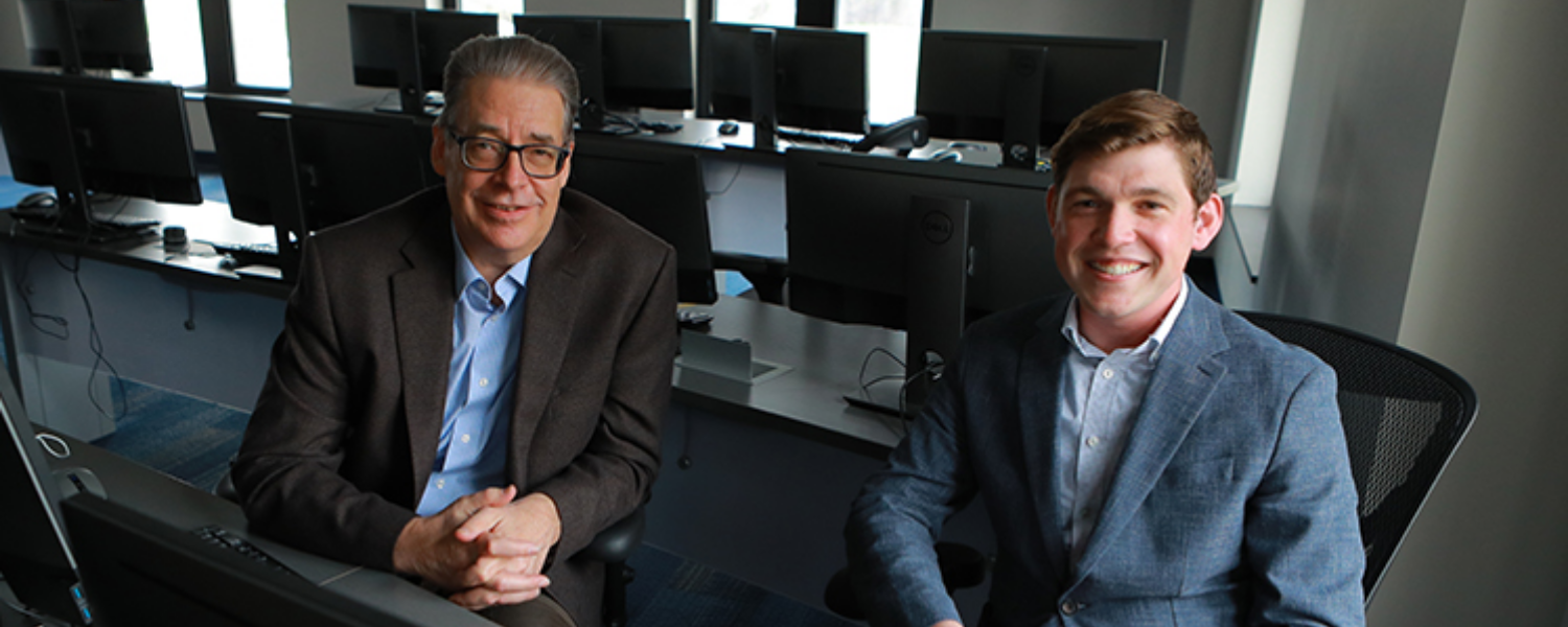 From left, Dr. Gary Insch, professor of management at UToledo, and Daniel Pfaltzgraf, visiting instructor of business technology and management at UToledo, co-authored a study suggesting younger generations are not as tech savvy as believed.