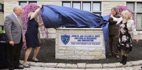 The sign outside of the College officially being unveiled, commemorating John Neff and celebrating the college's new moniker.