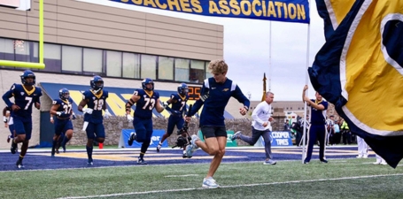 Xavier Gallo, a University of Toledo cross country athlete, turned a 2021 stress fracture into a photography opportunity, capturing significant moments for Toledo Athletics. His talent earned him a marketing internship, leading to video production work and a return to competition in 2022. Gallo also revitalized the Launchpad Student Section, balancing his roles as an athlete, student, and creative talent.