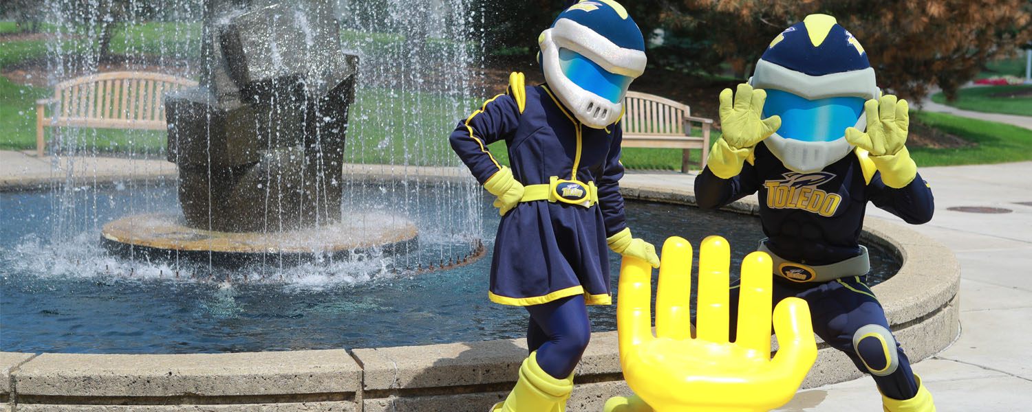 Rocky and Rocksy with the Handshake Chair near the water fountain 