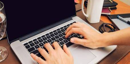 a student working on a laptop 