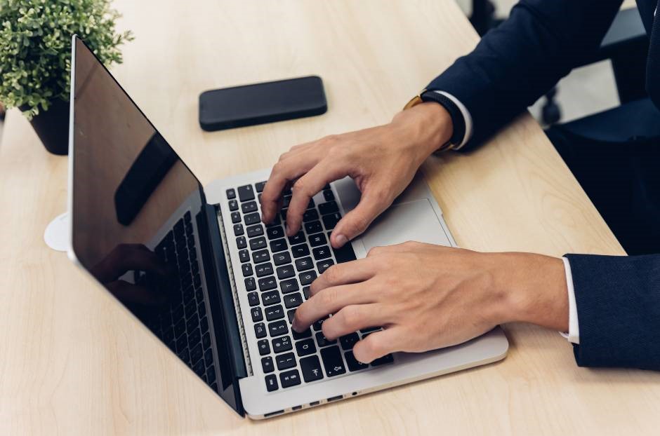 Man typing on a computer