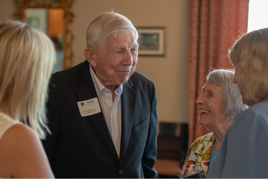 Family Business Center members conversing as an event