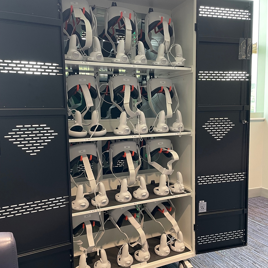 A storage cabinet full of VR headsets
