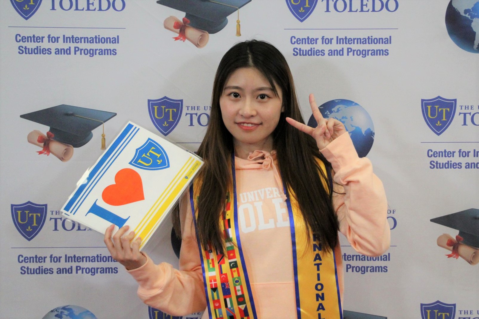 student posing with certificate for first place in rice cook-off