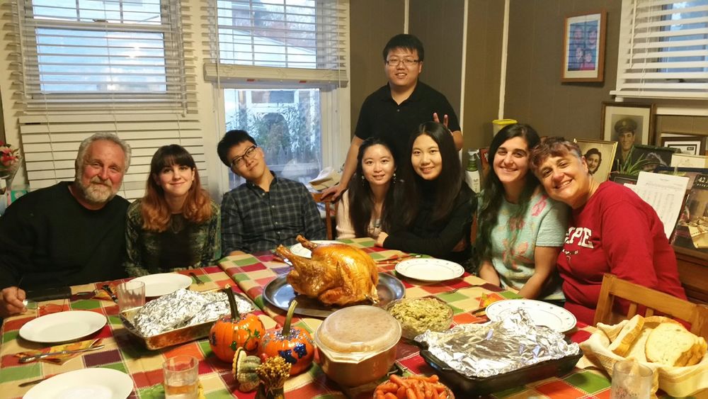 students around their carved pumpkin