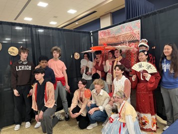 students dressed in traditional chinese clothing