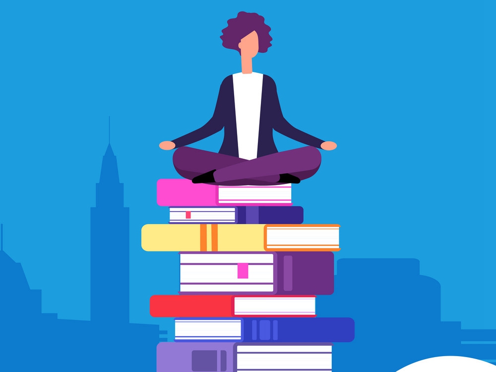 person sitting on stack of books