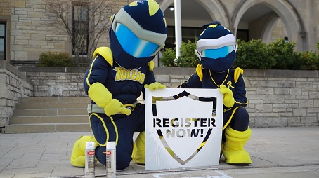 Rocky and Rocksy with Register Now sign