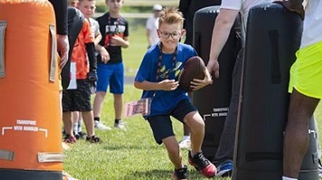 Rocket kid playing football
