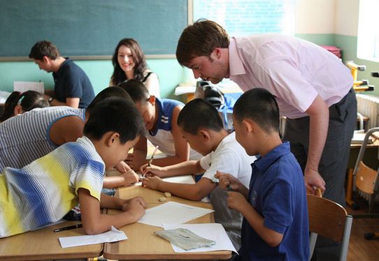 person teaching in a classroom abroad