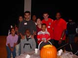 Manil, Zijuan, Claudine, and Simon  at the Harvest Party with the Pettaway Family