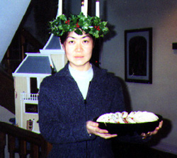 student is wearing a traditional St. Lucia wreath at Christmastime.
