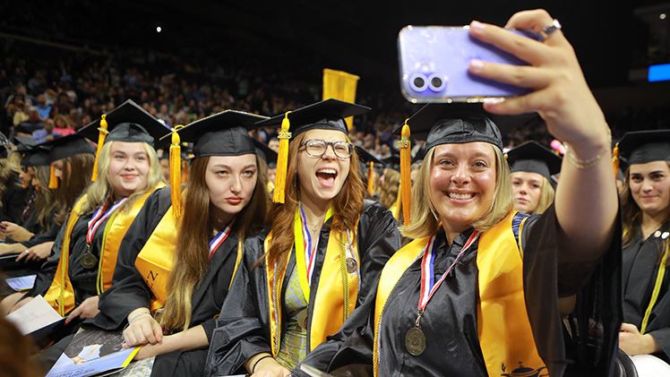 nursing students taking selfie at commencement