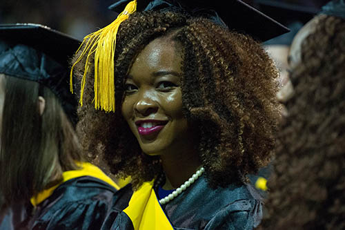 Student at commencement with gold tassel