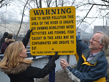 Warning signs being removed