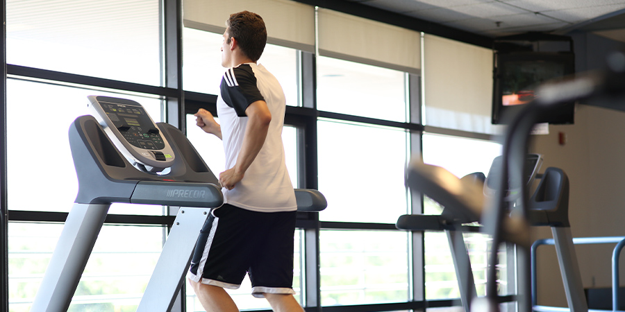 Photo of person working out on a treadmill at the Morse Center