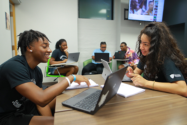 Members of the Multicultural Emerging Scholars Program studying together