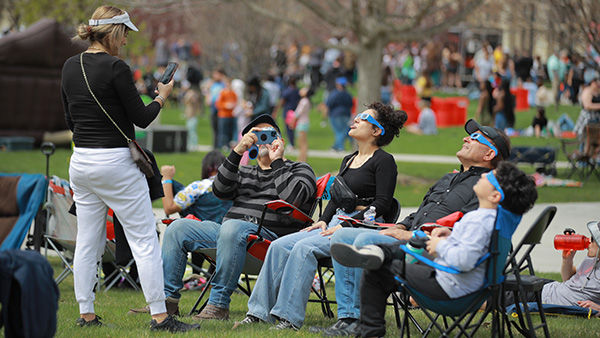 A group of people gathered on UToledo's campus for the eclipse