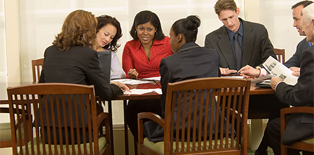 diverse group of 6 people at a conference table