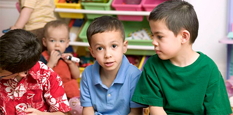 children sitting in a circle at a daycare