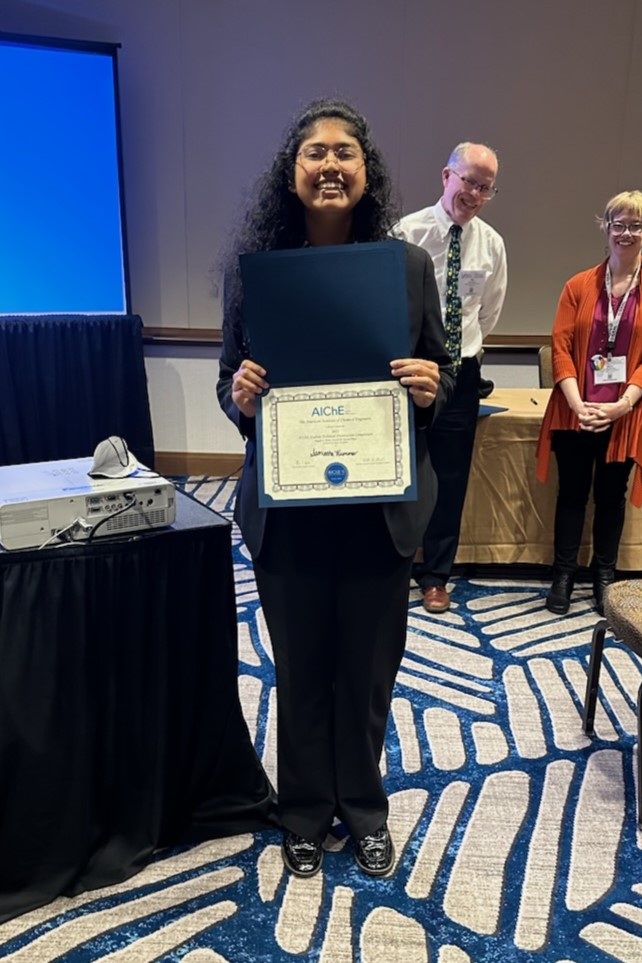 Sami Kumar holding her 2nd place award