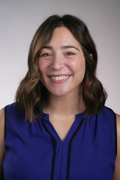 ryanmartindale smiling woman in sleeveless blue shirt