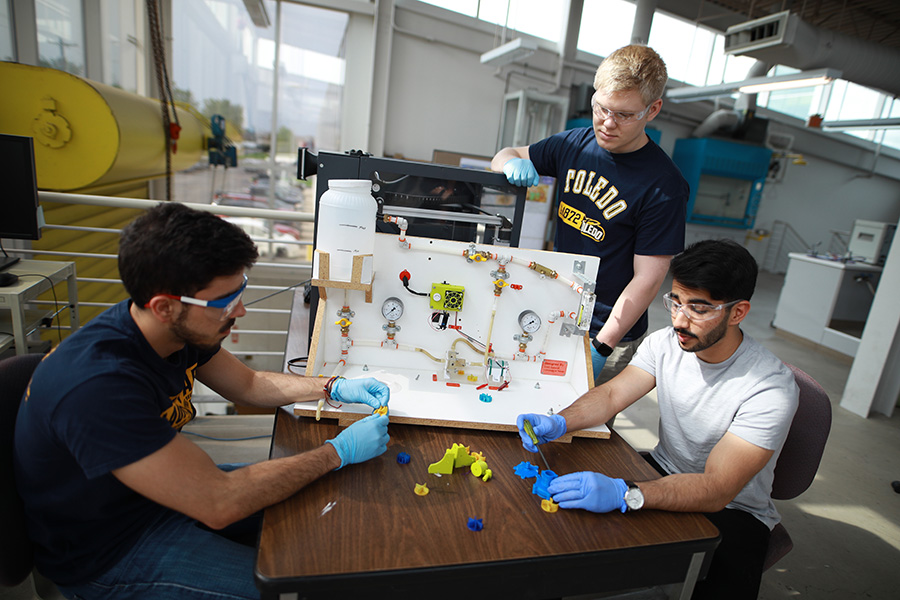 Engineering students working together on a project