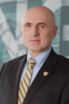 sorincioc bald man with blue suit and tie
