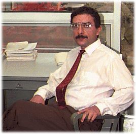 Mehdi Pourazady sitting in office