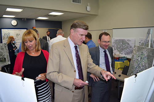 University of Toledo staff reviewing campus maps and plans