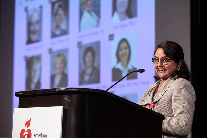 Bina Joe, Ph.D., giving a speech presented by The American Heart Association