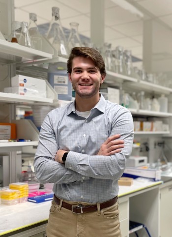 Nicholas Henkel standing in a laboratory