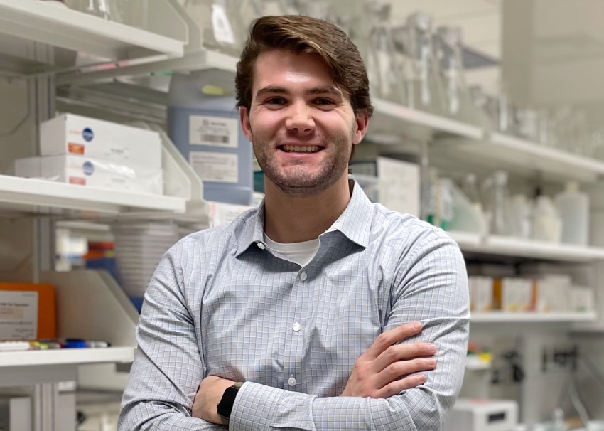 Nicholas Henkel standing in a laboratory