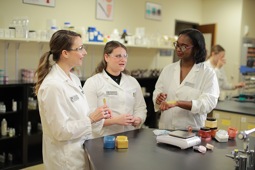 Healthcare students conversing in a laboratory
