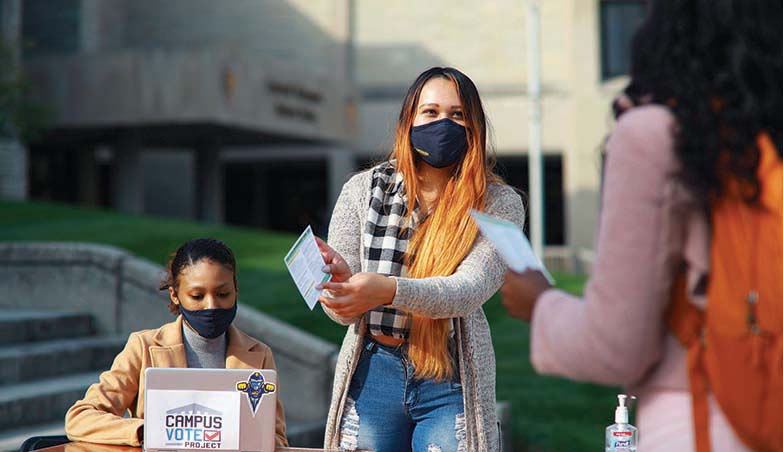 Students working outdoors for the Campus Vote Project