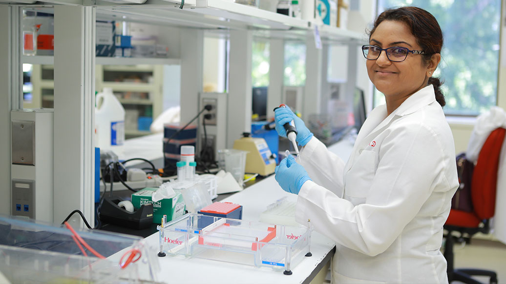 Bina Joe working in a lab