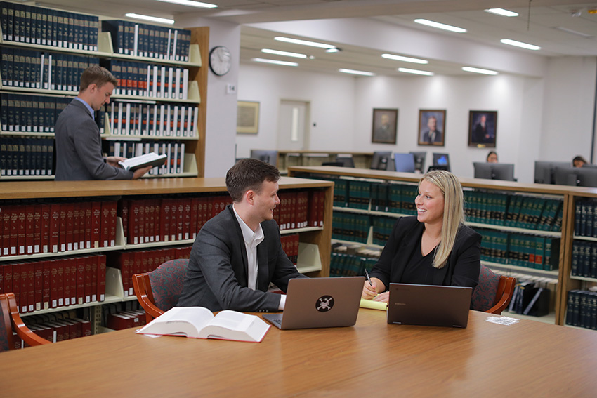 Law students studying in a library.