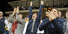 Students cheering at event Students cheering at event