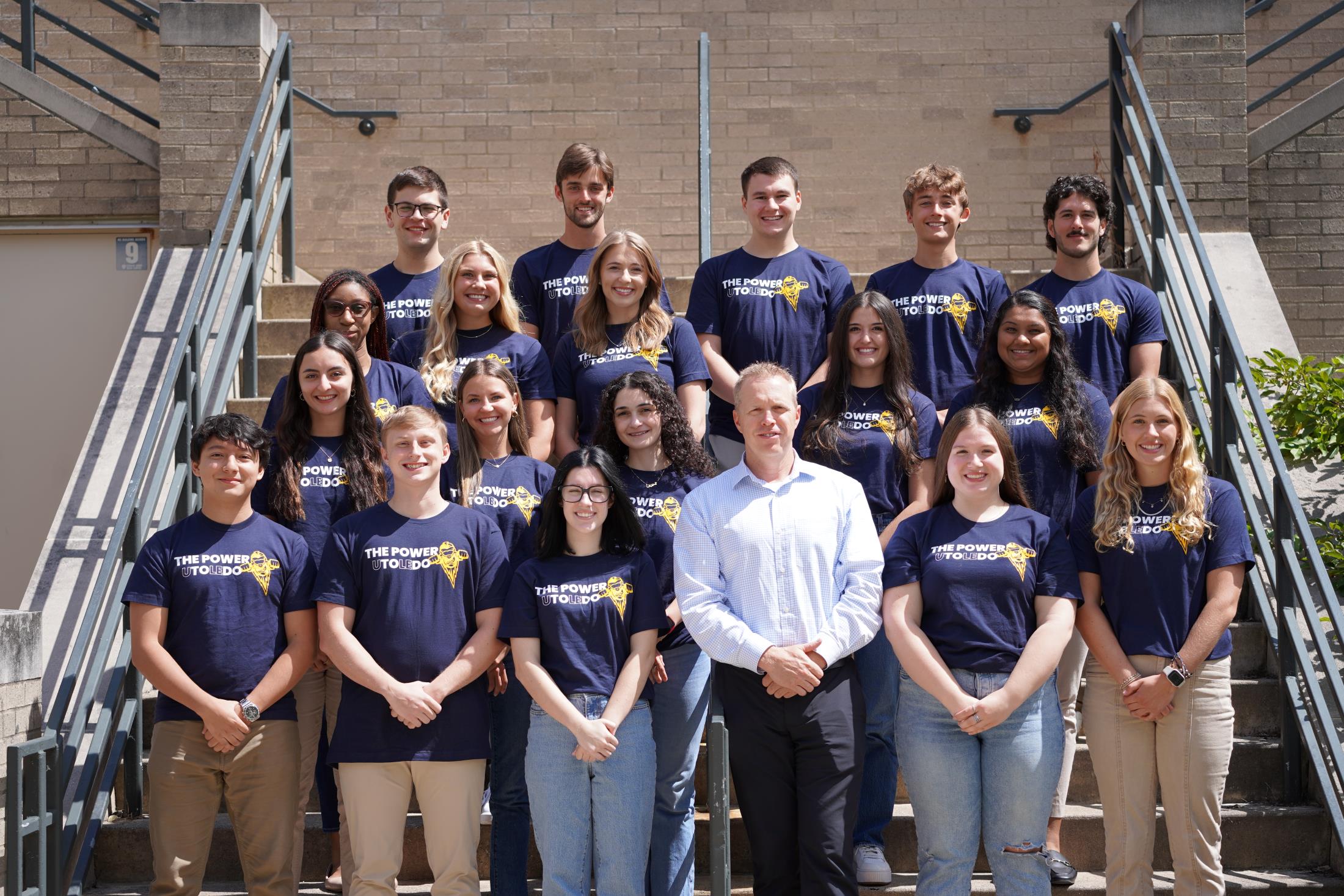 group of Presidential Ambassador student leaders posing for a photo with Interim President Matt Schroeder