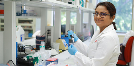 Bina Joe working in a lab