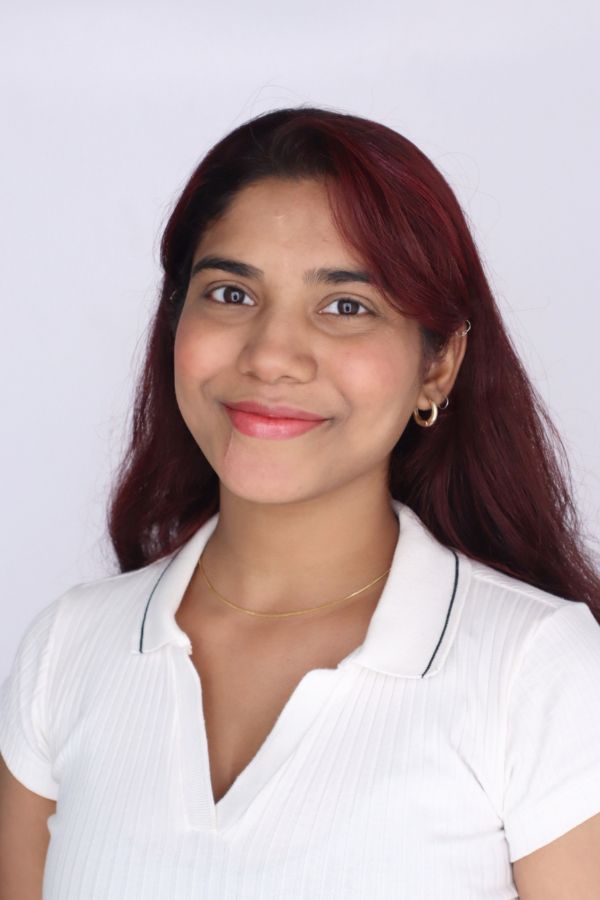 Eshwari Ghavare Eshwari Ghavare headshot. Woman in white shirt smiling.