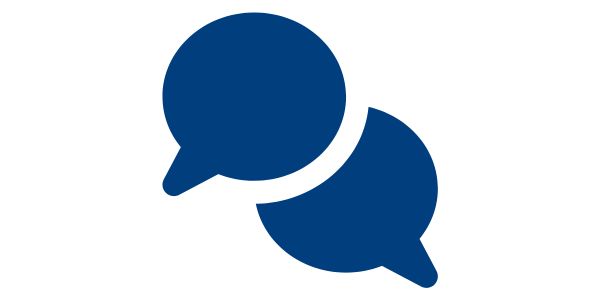 Dark blue flat icon of speech bubbles