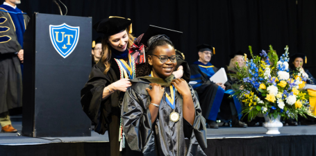 Pharmacy master's candidate is hooded at College of Pharmacy and Pharmaceutical Sciences Commencement.