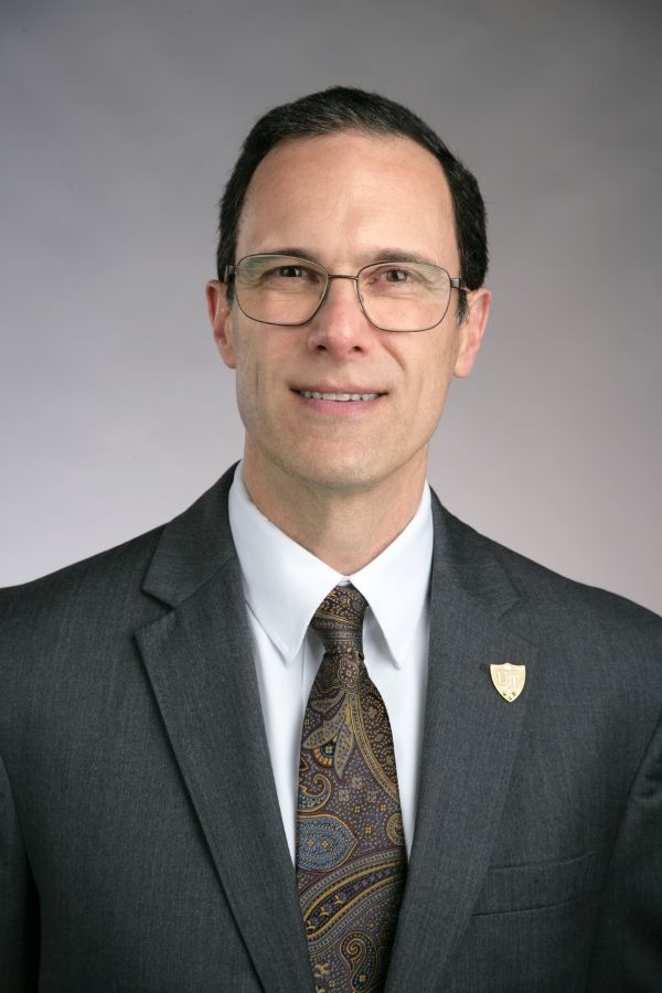 Scott Molitor Scott Molitor Headshot. Man in glasses and blazer smiling.