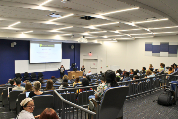 TA Training 2024 Instructor presenting to auditorium classroom of students