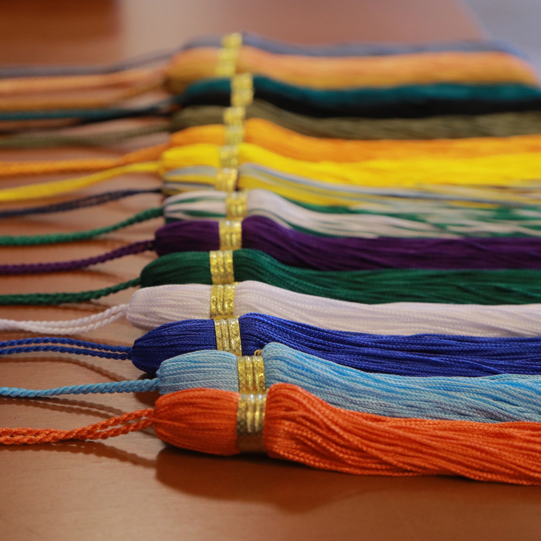 Colorful tassels lined up on a table
