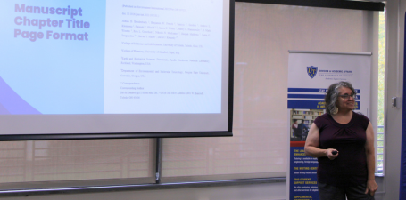 Person presenting a slide at a workshop