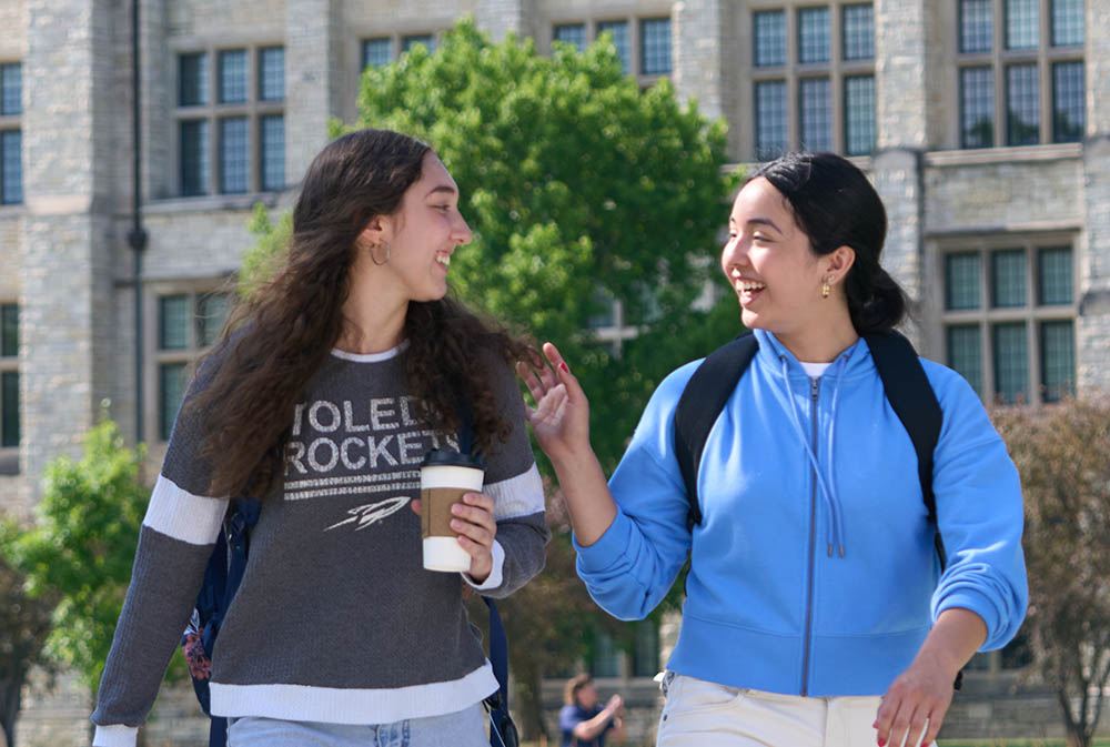 two student walking together in Centennial Mall