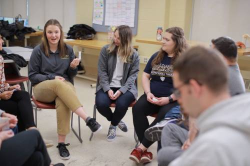 OTD students talking in a circle